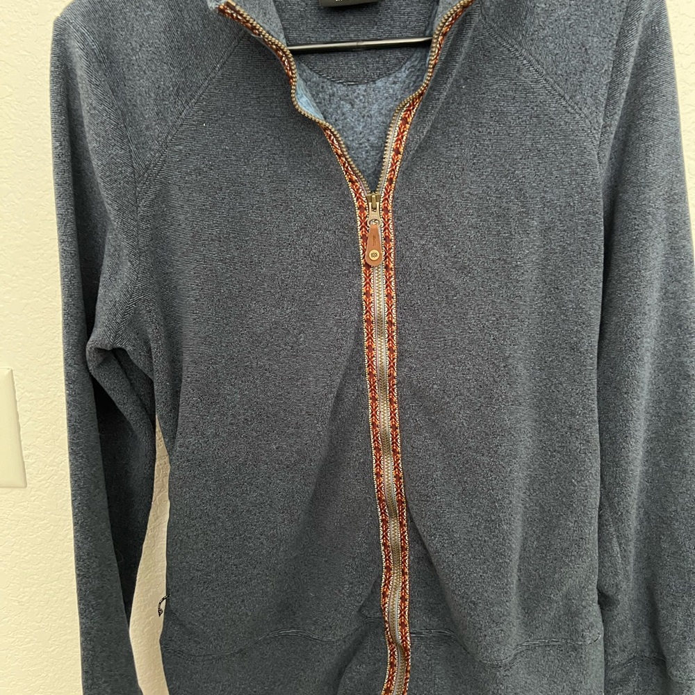 Sherpa Adventure Gear Blue Jacket with Red Trim